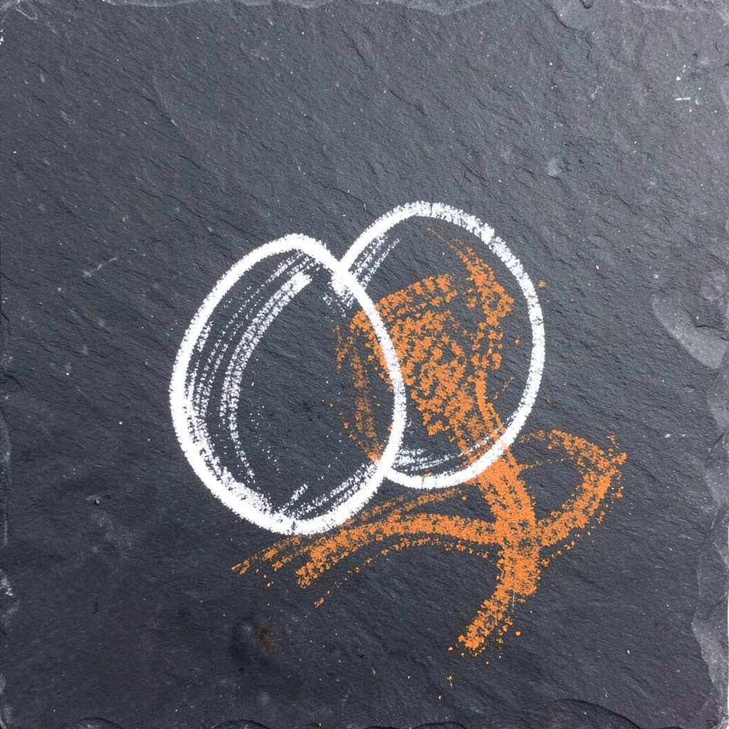 Chalk drawing of grass-fed eggs and leafy greens on a dark slate board, soft beige with gentle olive accents
